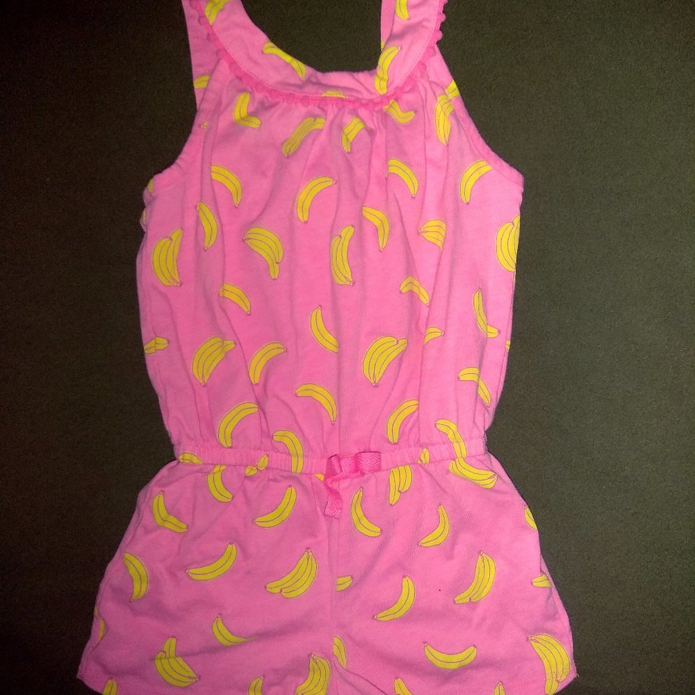 pink sleeveless banana print romper w/tassel trim